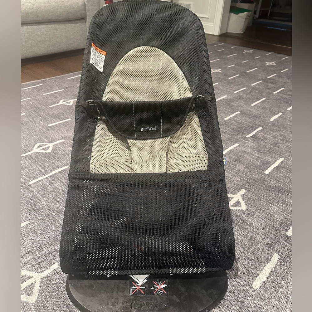 BabyBjorn bouncer. Lightly used. Slight discoloring noted on the laying part.